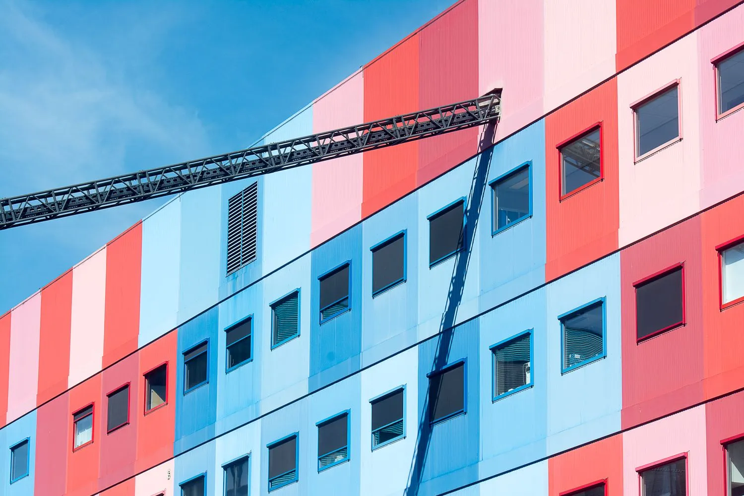 Blue and vermilion geometric facade detail